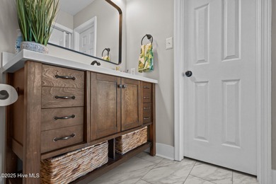 Discover this beautifully renovated, fully furnished end unit on Oak Island Golf Club in North Carolina - for sale on GolfHomes.com, golf home, golf lot