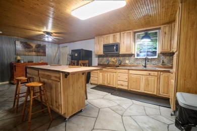 RIVERFRONT HOME located on South Fork River! Many updates on Cherokee Village North Course in Arkansas - for sale on GolfHomes.com, golf home, golf lot