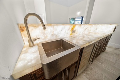 Stunning Full Home Remodel located on an EXTRA WIDE and DEEP on Royal Tee Country Club in Florida - for sale on GolfHomes.com, golf home, golf lot