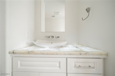 Stunning Full Home Remodel located on an EXTRA WIDE and DEEP on Royal Tee Country Club in Florida - for sale on GolfHomes.com, golf home, golf lot