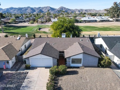 Welcome home to this charming 4-bedroom, 2-bath retreat nestled on Ahwatukee Country Club in Arizona - for sale on GolfHomes.com, golf home, golf lot