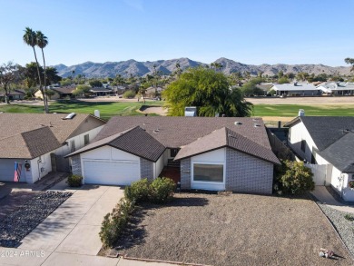 Welcome home to this charming 4-bedroom, 2-bath retreat nestled on Ahwatukee Country Club in Arizona - for sale on GolfHomes.com, golf home, golf lot