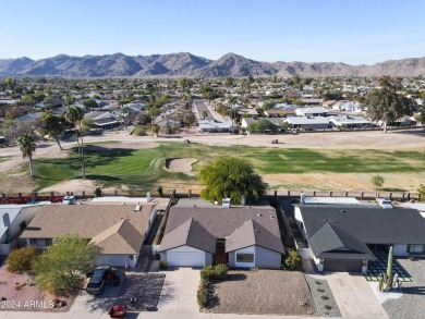 Welcome home to this charming 4-bedroom, 2-bath retreat nestled on Ahwatukee Country Club in Arizona - for sale on GolfHomes.com, golf home, golf lot