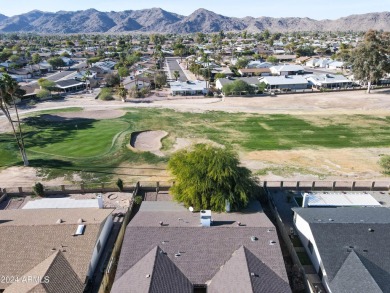 Welcome home to this charming 4-bedroom, 2-bath retreat nestled on Ahwatukee Country Club in Arizona - for sale on GolfHomes.com, golf home, golf lot