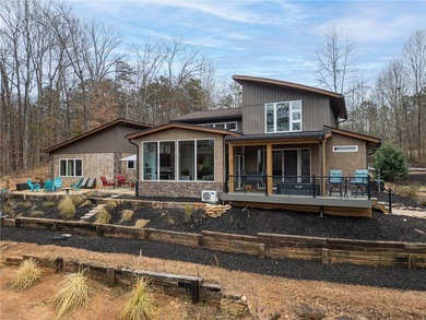 Stunning contemporary home on golf course with panoramic views on The Trail At Chickasaw Pointe in South Carolina - for sale on GolfHomes.com, golf home, golf lot