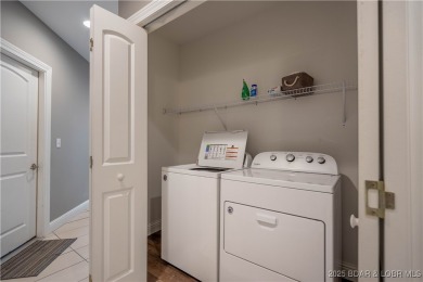 Welcome to this exceptional home in the coveted Redhead Cove on The Oaks Golf Course in Missouri - for sale on GolfHomes.com, golf home, golf lot