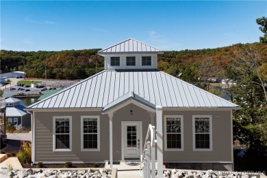 Welcome to this exceptional home in the coveted Redhead Cove on The Oaks Golf Course in Missouri - for sale on GolfHomes.com, golf home, golf lot