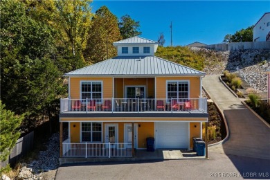 Welcome to this exceptional home in the coveted Redhead Cove on The Oaks Golf Course in Missouri - for sale on GolfHomes.com, golf home, golf lot