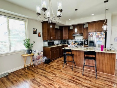 Located in a serene gated community, this beautifully designed on Mulligans Golf and Game in Utah - for sale on GolfHomes.com, golf home, golf lot