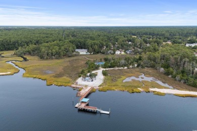 This charming 2BR/1BA home is located in the highly desirable on Glen Dornoch Waterway Golf Links in South Carolina - for sale on GolfHomes.com, golf home, golf lot