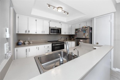 Welcome to this beautifully updated 2-bedroom, 2-bath corner on Cove Cay Country Club in Florida - for sale on GolfHomes.com, golf home, golf lot