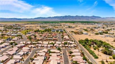 Step into this vibrant Fairway Estates home, where energy meets on Desert Lakes Golf Course in Arizona - for sale on GolfHomes.com, golf home, golf lot