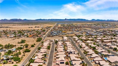 Step into this vibrant Fairway Estates home, where energy meets on Desert Lakes Golf Course in Arizona - for sale on GolfHomes.com, golf home, golf lot