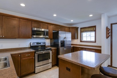 Welcome home to this stunning private-entry condo featuring open on Foxboro Golf Club in Wisconsin - for sale on GolfHomes.com, golf home, golf lot