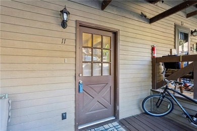 Step into resort-style living with this charming 2-bedroom, 2 on The Highlands Course at Lake Arrowhead in Georgia - for sale on GolfHomes.com, golf home, golf lot