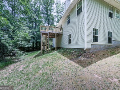 Welcome to this charming 5-bedroom, 3-bath brick home situated on Fairfield Plantation Golf and Country Club in Georgia - for sale on GolfHomes.com, golf home, golf lot