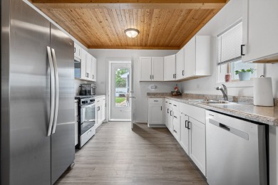 This stunning two-story home with an expansive and inviting on Waters Edge Golf Club in Illinois - for sale on GolfHomes.com, golf home, golf lot