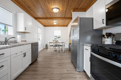 This stunning two-story home with an expansive and inviting on Waters Edge Golf Club in Illinois - for sale on GolfHomes.com, golf home, golf lot
