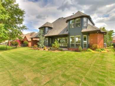 ENJOY THE VIEW OF THE GOLF COURSE FROM THE FIFTEENTH FAIRWAY! on Oak Tree National Golf and Country Club in Oklahoma - for sale on GolfHomes.com, golf home, golf lot
