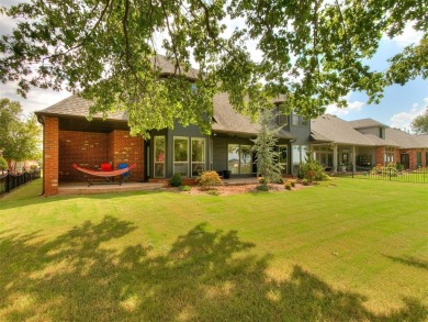 ENJOY THE VIEW OF THE GOLF COURSE FROM THE FIFTEENTH FAIRWAY! on Oak Tree National Golf and Country Club in Oklahoma - for sale on GolfHomes.com, golf home, golf lot