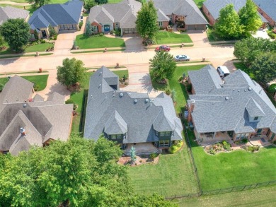 ENJOY THE VIEW OF THE GOLF COURSE FROM THE FIFTEENTH FAIRWAY! on Oak Tree National Golf and Country Club in Oklahoma - for sale on GolfHomes.com, golf home, golf lot