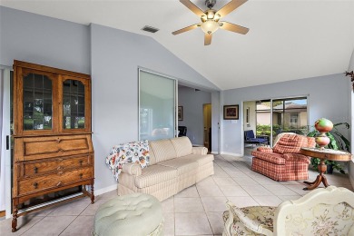 This 3-bedroom former model home sits on Hole 2 of Harbor Hills on Harbor Hills Country Club in Florida - for sale on GolfHomes.com, golf home, golf lot