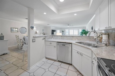 GOLFER'S DELIGHT! END UNIT with stunning GOLF COURSE VIEWS on on Highland Lakes Executive Golf Course in Florida - for sale on GolfHomes.com, golf home, golf lot
