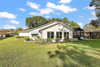 This 3-bedroom former model home sits on Hole 2 of Harbor Hills on Harbor Hills Country Club in Florida - for sale on GolfHomes.com, golf home, golf lot