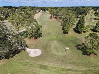 GOLFER'S DELIGHT! END UNIT with stunning GOLF COURSE VIEWS on on Highland Lakes Executive Golf Course in Florida - for sale on GolfHomes.com, golf home, golf lot