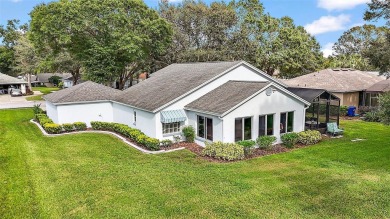 This 3-bedroom former model home sits on Hole 2 of Harbor Hills on Harbor Hills Country Club in Florida - for sale on GolfHomes.com, golf home, golf lot