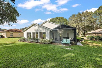 This 3-bedroom former model home sits on Hole 2 of Harbor Hills on Harbor Hills Country Club in Florida - for sale on GolfHomes.com, golf home, golf lot