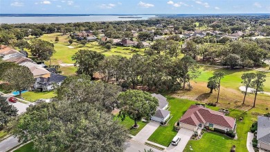 This 3-bedroom former model home sits on Hole 2 of Harbor Hills on Harbor Hills Country Club in Florida - for sale on GolfHomes.com, golf home, golf lot