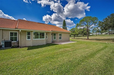 GOLFER'S DELIGHT! END UNIT with stunning GOLF COURSE VIEWS on on Highland Lakes Executive Golf Course in Florida - for sale on GolfHomes.com, golf home, golf lot