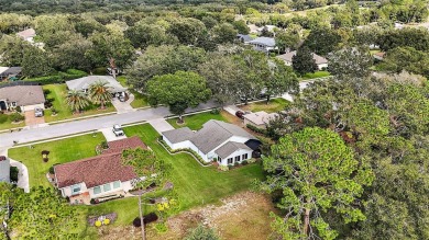 This 3-bedroom former model home sits on Hole 2 of Harbor Hills on Harbor Hills Country Club in Florida - for sale on GolfHomes.com, golf home, golf lot