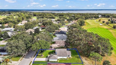 This 3-bedroom former model home sits on Hole 2 of Harbor Hills on Harbor Hills Country Club in Florida - for sale on GolfHomes.com, golf home, golf lot