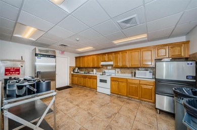 GOLFER'S DELIGHT! END UNIT with stunning GOLF COURSE VIEWS on on Highland Lakes Executive Golf Course in Florida - for sale on GolfHomes.com, golf home, golf lot