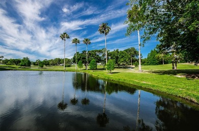 GOLFER'S DELIGHT! END UNIT with stunning GOLF COURSE VIEWS on on Highland Lakes Executive Golf Course in Florida - for sale on GolfHomes.com, golf home, golf lot
