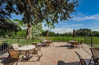 GOLFER'S DELIGHT! END UNIT with stunning GOLF COURSE VIEWS on on Highland Lakes Executive Golf Course in Florida - for sale on GolfHomes.com, golf home, golf lot