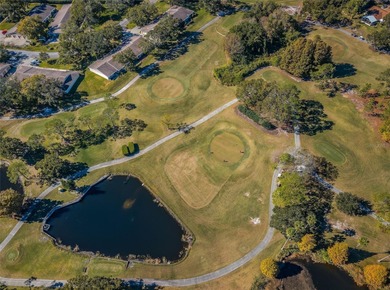 GOLFER'S DELIGHT! END UNIT with stunning GOLF COURSE VIEWS on on Highland Lakes Executive Golf Course in Florida - for sale on GolfHomes.com, golf home, golf lot