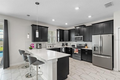 Beautifully furnished and very well maintained 7-bedroom on ChampionsGate Golf Resort in Florida - for sale on GolfHomes.com, golf home, golf lot