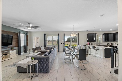 Beautifully furnished and very well maintained 7-bedroom on ChampionsGate Golf Resort in Florida - for sale on GolfHomes.com, golf home, golf lot