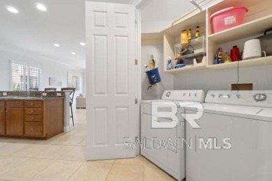 The Links Golf Villas, Unit E101.  Discover luxury coastal on Peninsula Golf and Racquet Club in Alabama - for sale on GolfHomes.com, golf home, golf lot