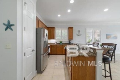 The Links Golf Villas, Unit E101.  Discover luxury coastal on Peninsula Golf and Racquet Club in Alabama - for sale on GolfHomes.com, golf home, golf lot