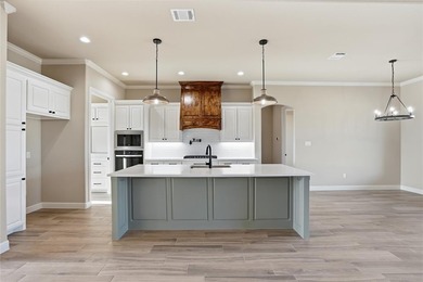 Located on a prime corner lot in the highly sought-after country on Pecan Plantation Country Club in Texas - for sale on GolfHomes.com, golf home, golf lot