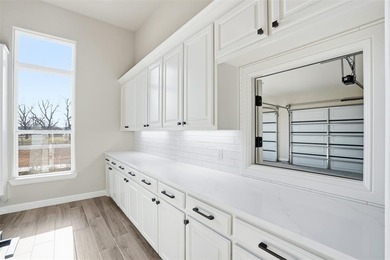 Located on a prime corner lot in the highly sought-after country on Pecan Plantation Country Club in Texas - for sale on GolfHomes.com, golf home, golf lot