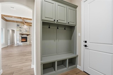 Located on a prime corner lot in the highly sought-after country on Pecan Plantation Country Club in Texas - for sale on GolfHomes.com, golf home, golf lot