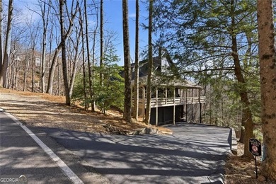 This Rustic Mountain Lodge is perfectly positioned on nearly a on Big Canoe Golf Club - Cherokee in Georgia - for sale on GolfHomes.com, golf home, golf lot