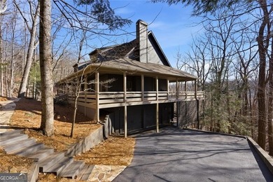 This Rustic Mountain Lodge is perfectly positioned on nearly a on Big Canoe Golf Club - Cherokee in Georgia - for sale on GolfHomes.com, golf home, golf lot
