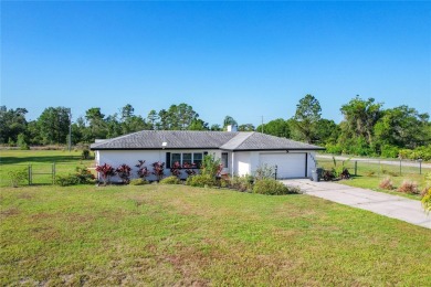 Amazing Pool home on 1 acre with complete outside kitchen by on Indian Lake Estates Golf and Country Club in Florida - for sale on GolfHomes.com, golf home, golf lot