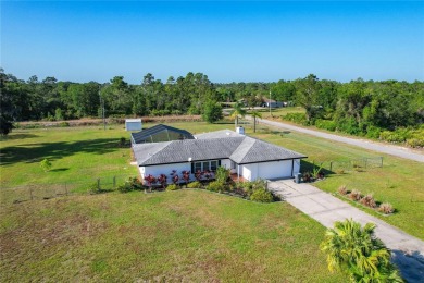 Amazing Pool home on 1 acre with complete outside kitchen by on Indian Lake Estates Golf and Country Club in Florida - for sale on GolfHomes.com, golf home, golf lot